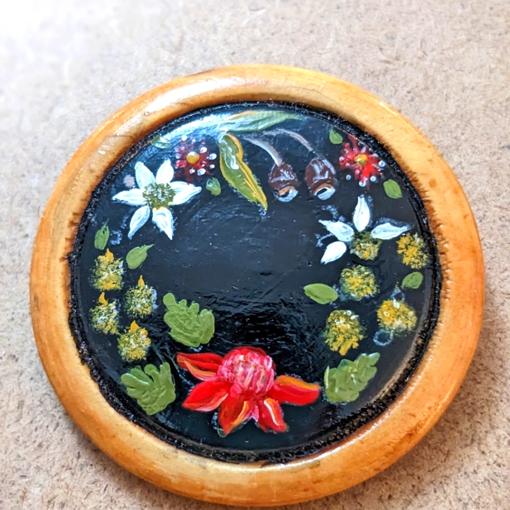 Handcrafted Floral Art Piece with Black and Brown Accents